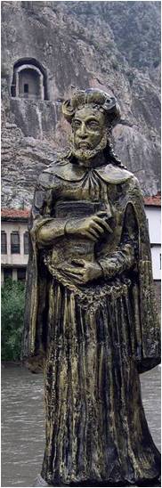 The Imaginary Statue of Strabo The Geographer in his home land Amasya, Turkey located along the Iris River and in front of the tombs of the Pontite Kings carved into limestone