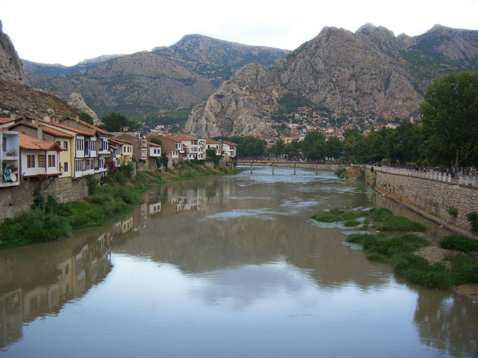 The Yeşilırmak at dusk, houses on both banks and jagged peaks closing the valley
